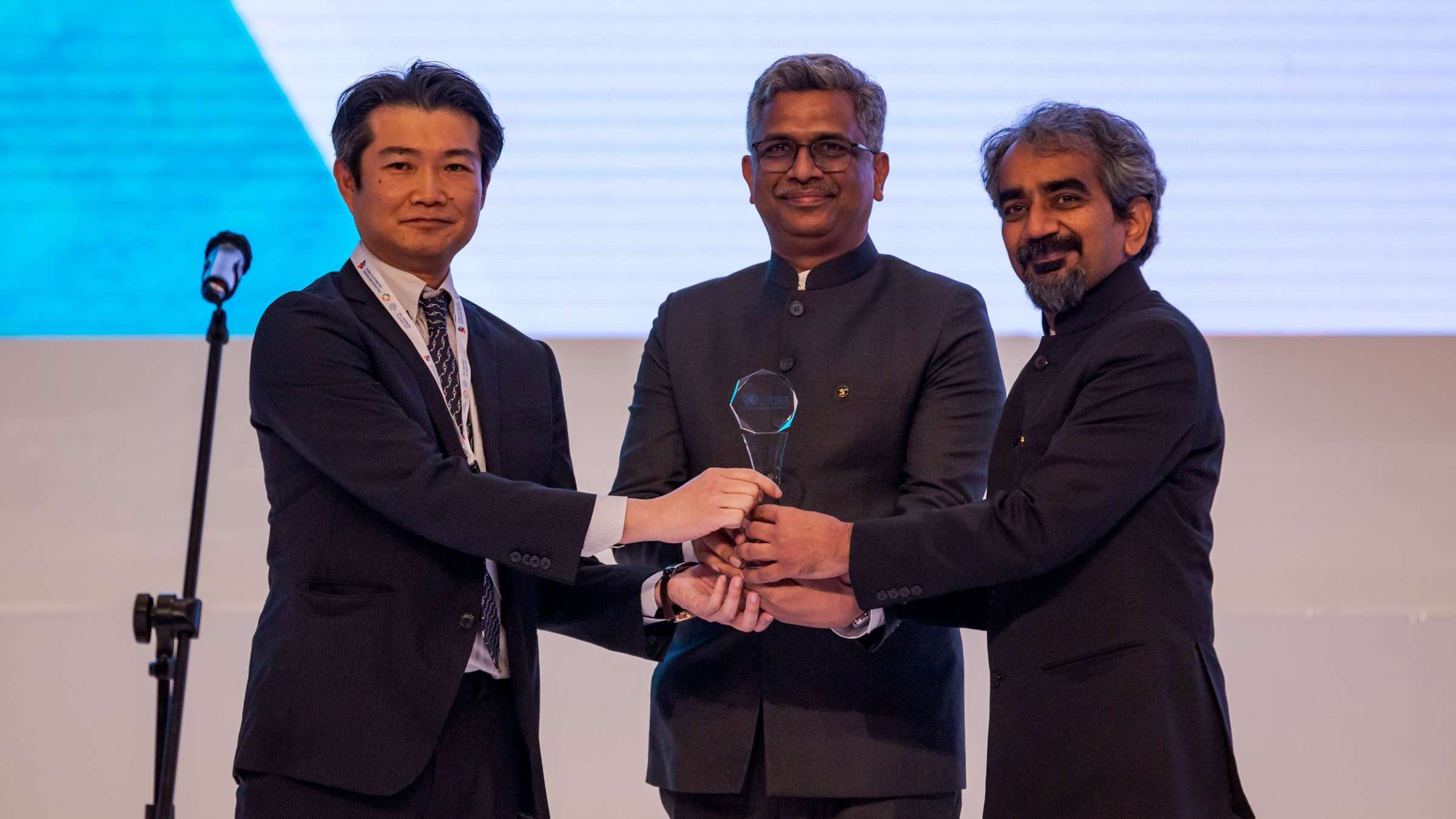 Masato Seko, Senior Program Director of Global Issues Department, The Nippon Foundation presents the UN Sasakawa Award 2022 for Disaster Risk Reduction to Dr Manu Gupta and Dr Anshu Sharma, Founders, SEEDS